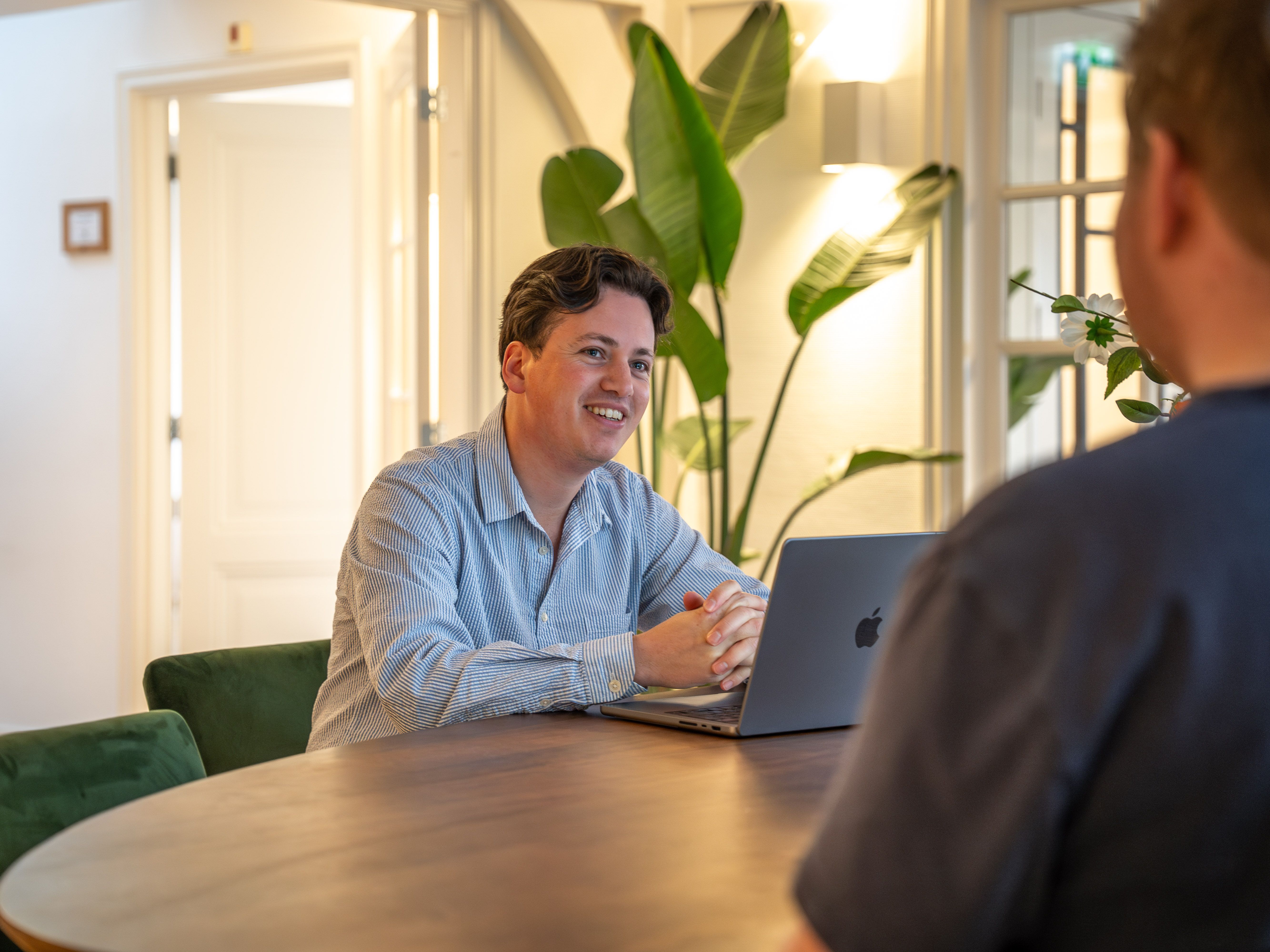 Copilot consultant talking things through with a client at the work table