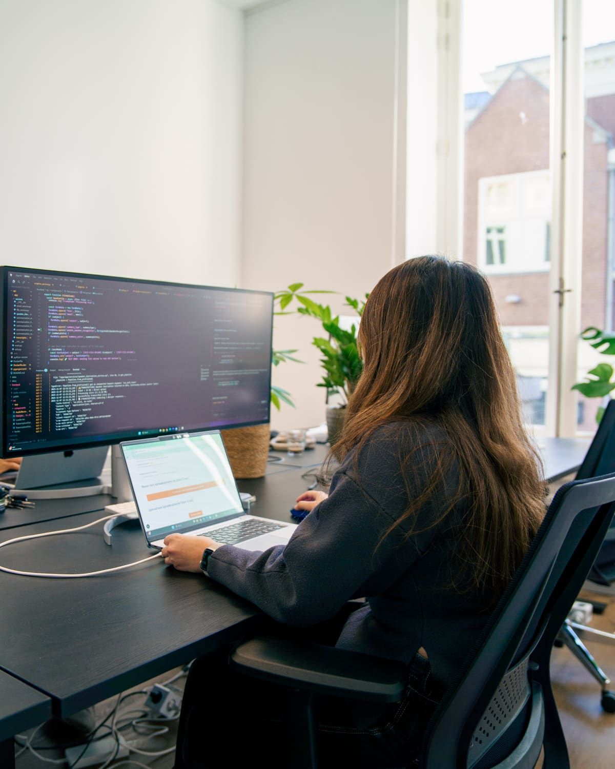 Sharanda building a Copilot agent behind two screens